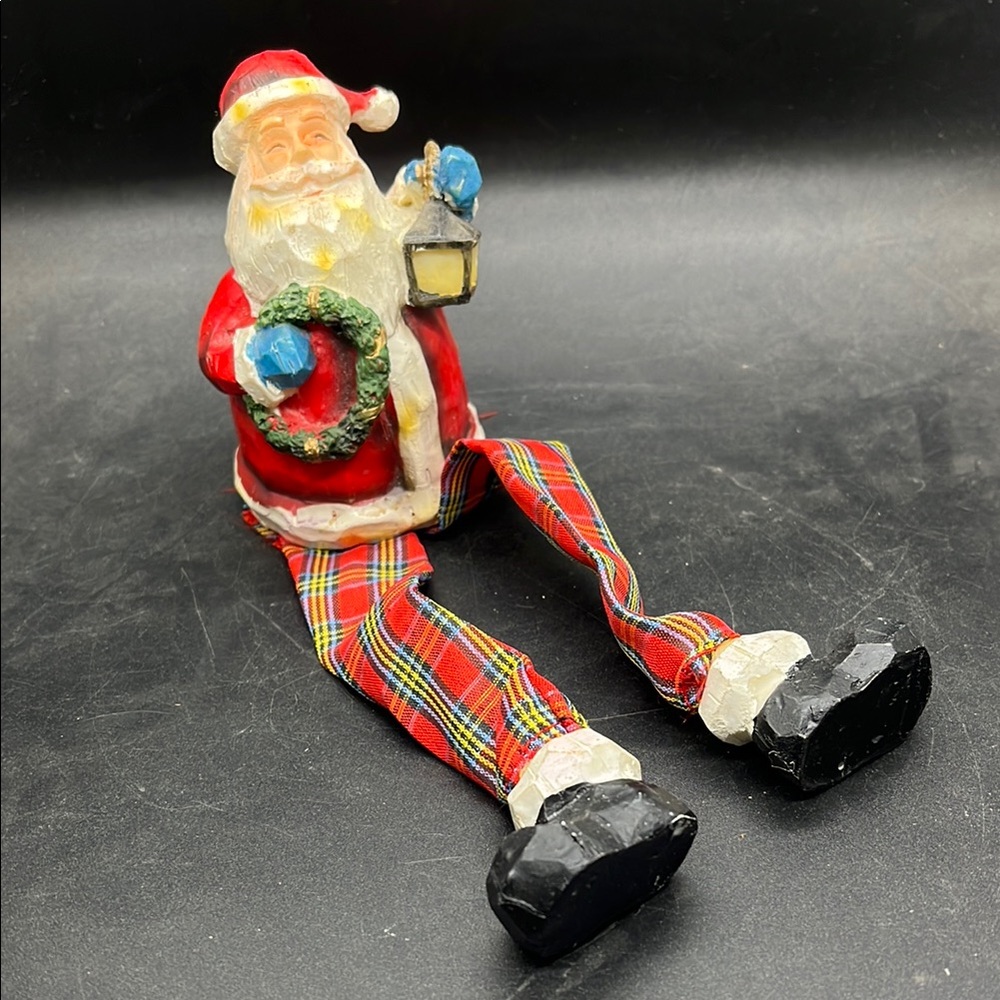 Festive Red Santa Figurine with Plaid Legs